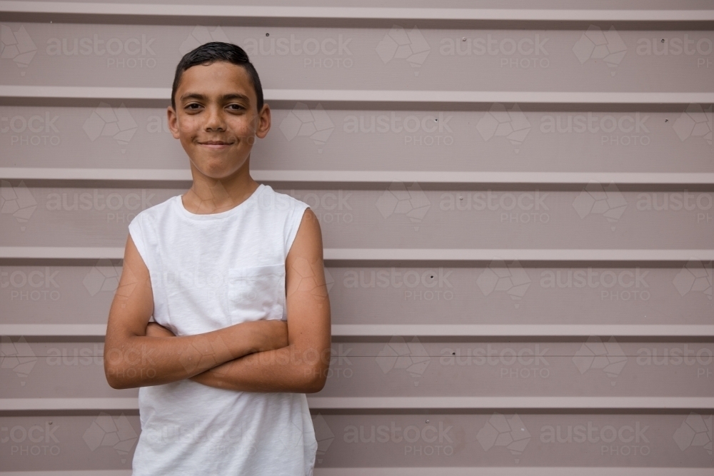 Image of Portrait of a young, smiling first nations boy - Austockphoto