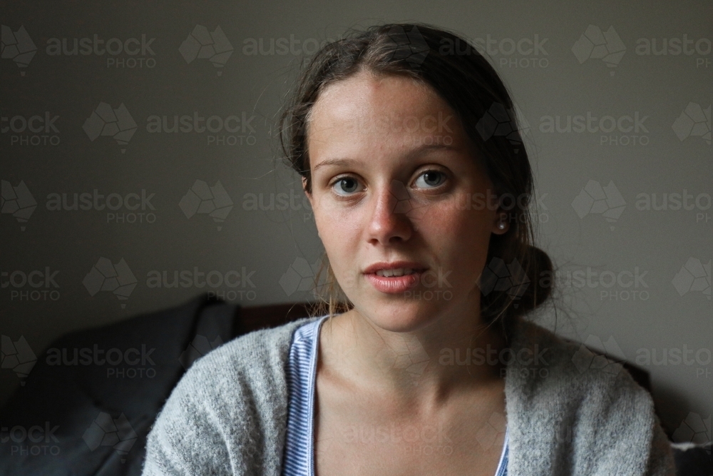 Portrait of a young teenage girl indoors - Australian Stock Image