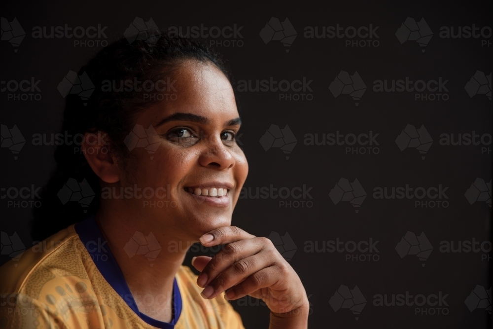 Portrait of Aboriginal woman looking at the camera - Australian Stock Image