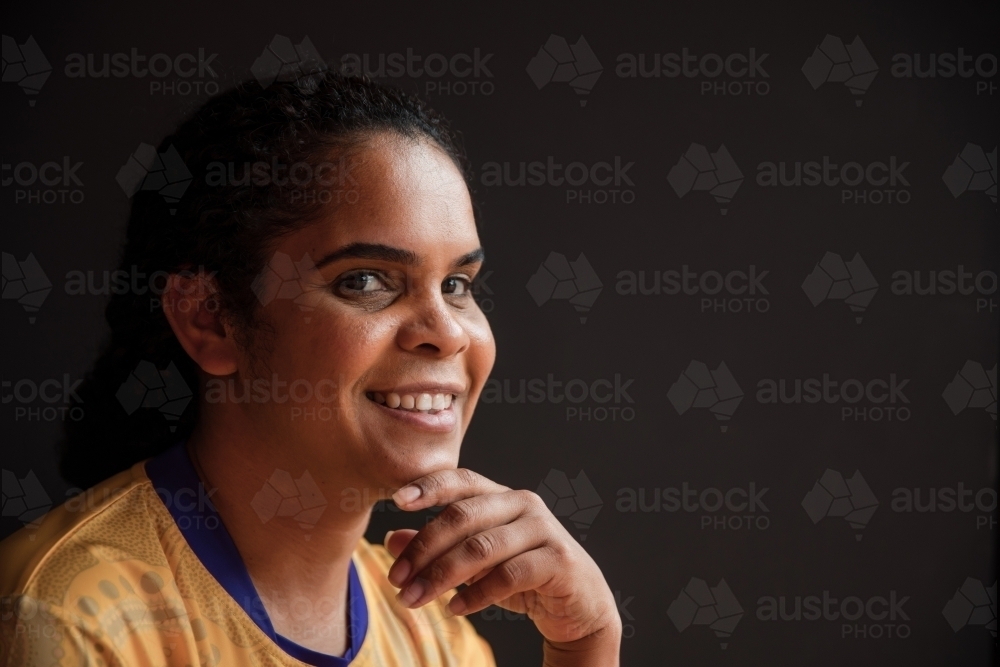 Portrait of Aboriginal woman looking at the camera - Australian Stock Image