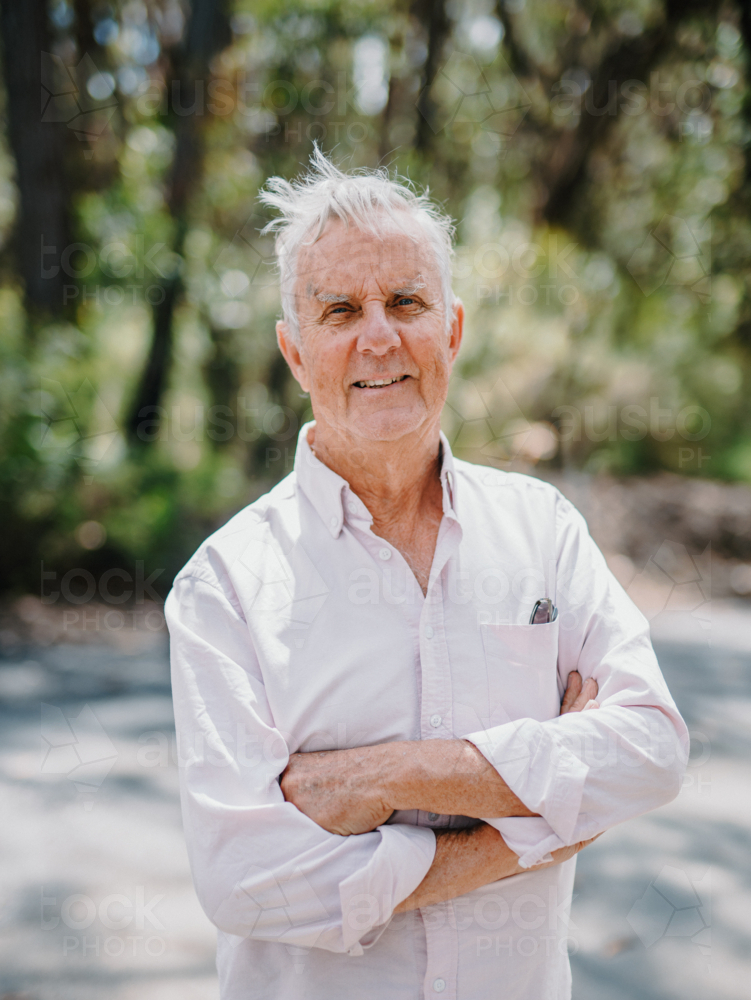 Portrait of Elderly man enjoying a healthy lifestyle in nature - Australian Stock Image