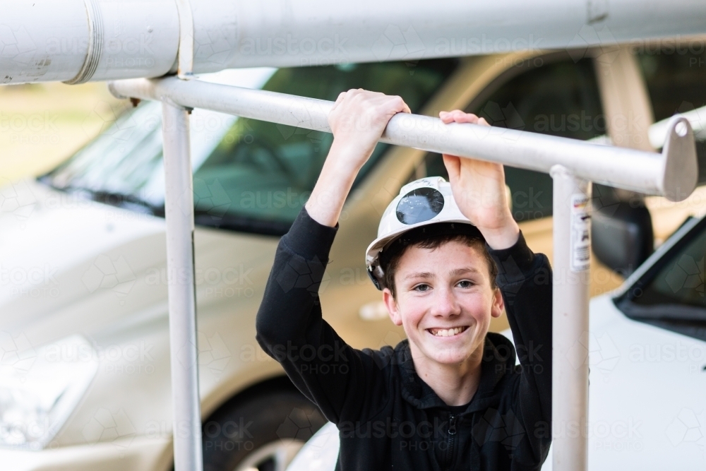 Portrait of teenage boy son of a tradie smiling - Australian Stock Image