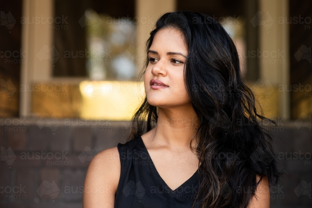 portrait of young Indian woman, looking away - Australian Stock Image