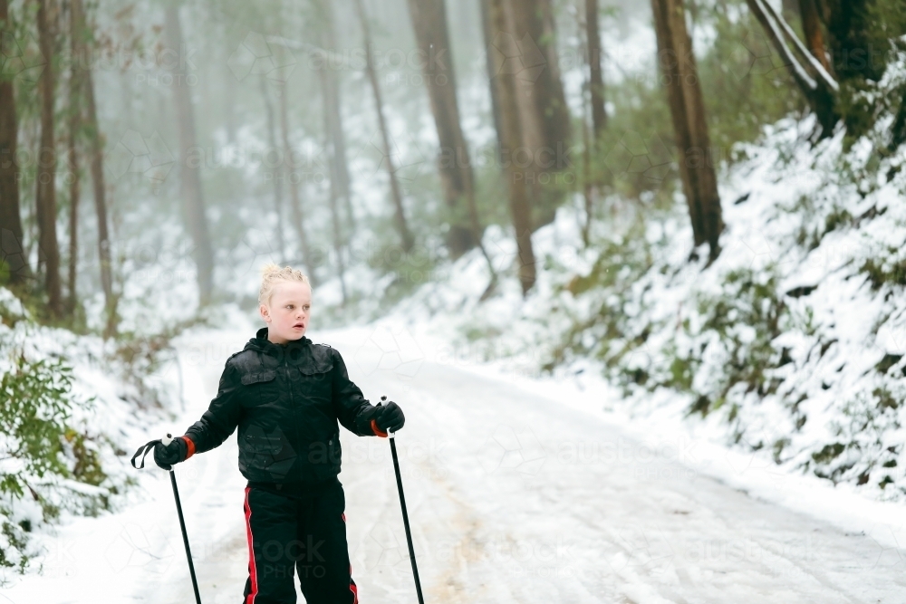 Pre-teen boy cross country skiing at Mount Stirling in the alpine region of Australia's high country - Australian Stock Image