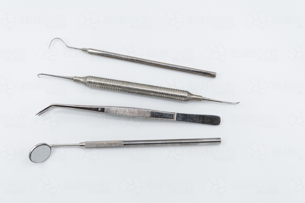 Professional dental instruments on white background - Australian Stock Image