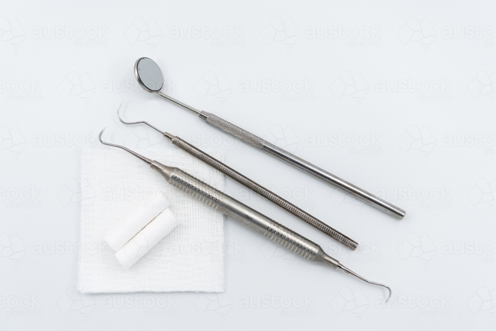 Professional dental instruments on white background - Australian Stock Image