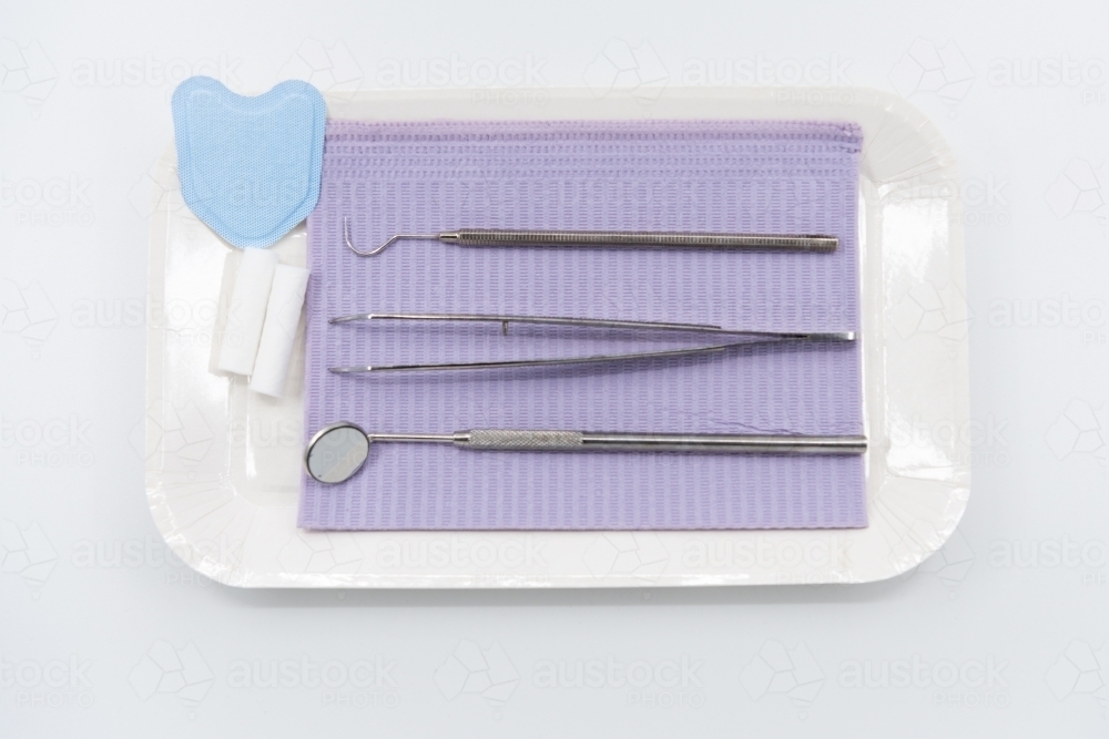 Professional dental instruments on white background - Australian Stock Image