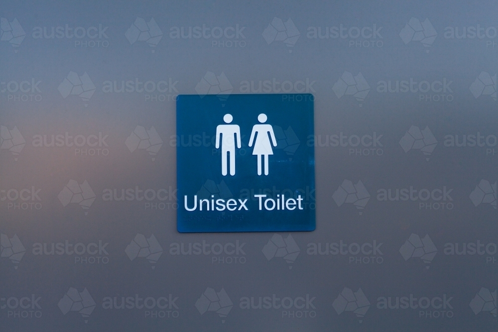 Public toilet block with unisex toilet sign on door - Australian Stock Image