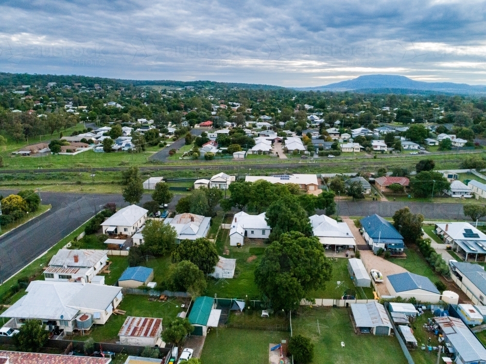 Railway line running through small country town of Gunnedah in the evening on overcast day - Australian Stock Image