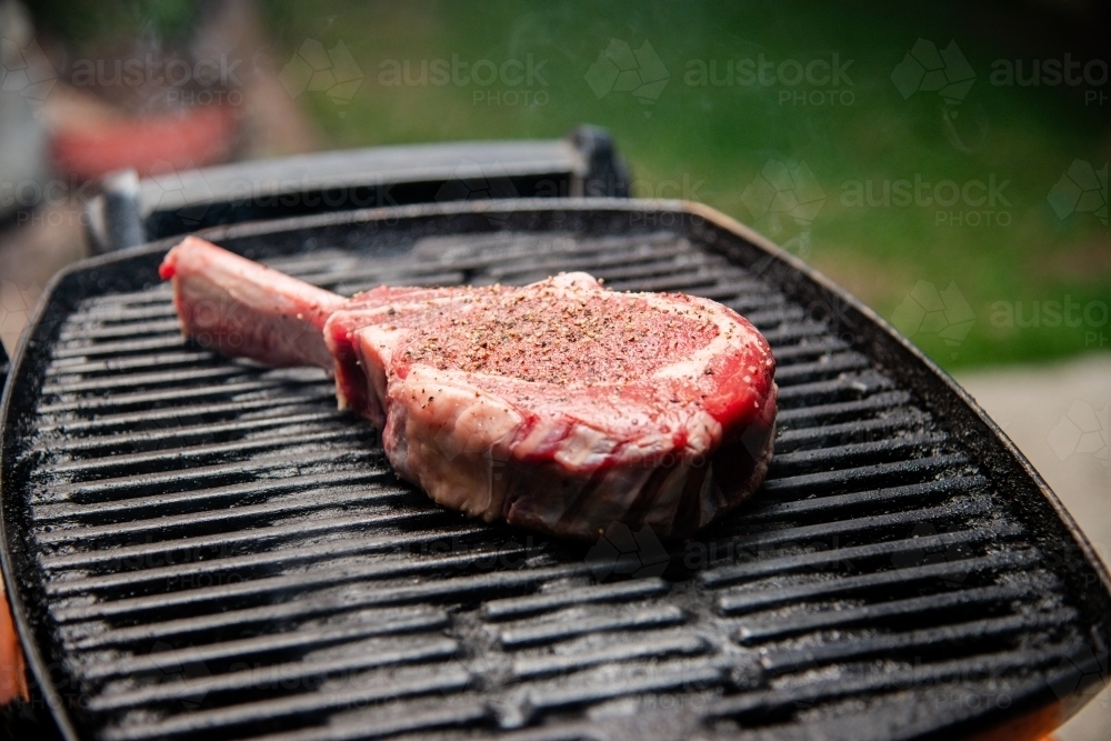 Raw Steak on a BBQ - Australian Stock Image