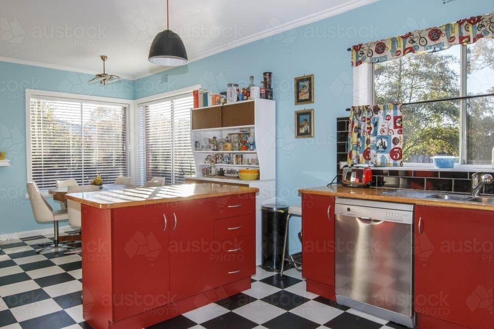 Red and teal retro kitchen interior - Australian Stock Image