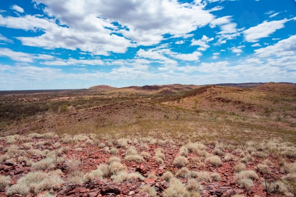 Red soil looking over the hot arid Australian land - Australian Stock Image