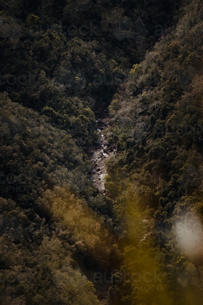Remote river at the bottom of a valley at Kanangra Walls Lookout, NSW - Australian Stock Image