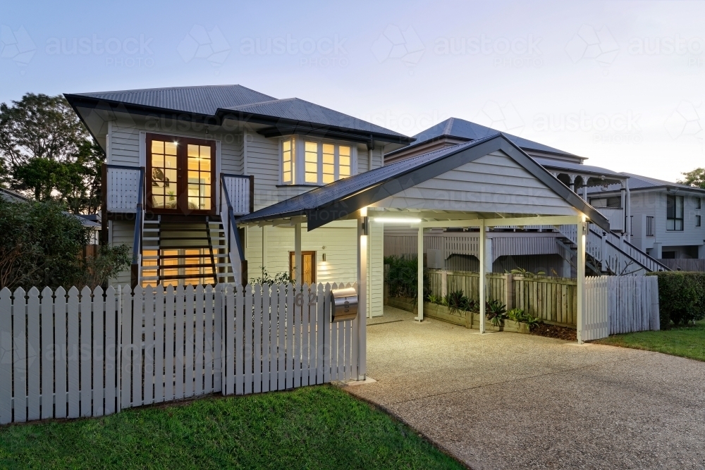 Renovated Queenslander home at twilight - Australian Stock Image