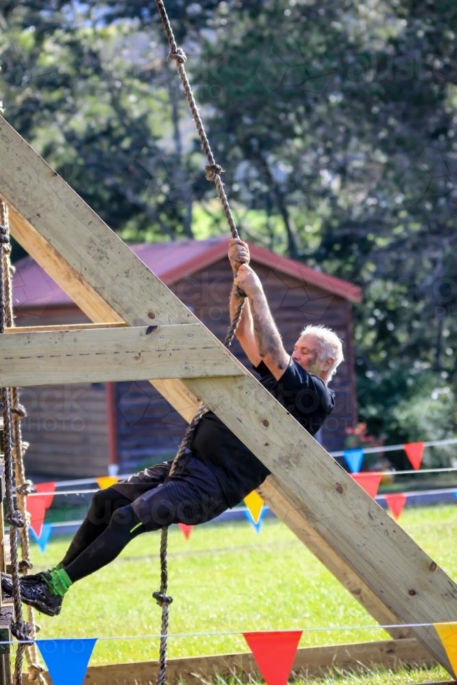 Retiree completing fitness course - Australian Stock Image