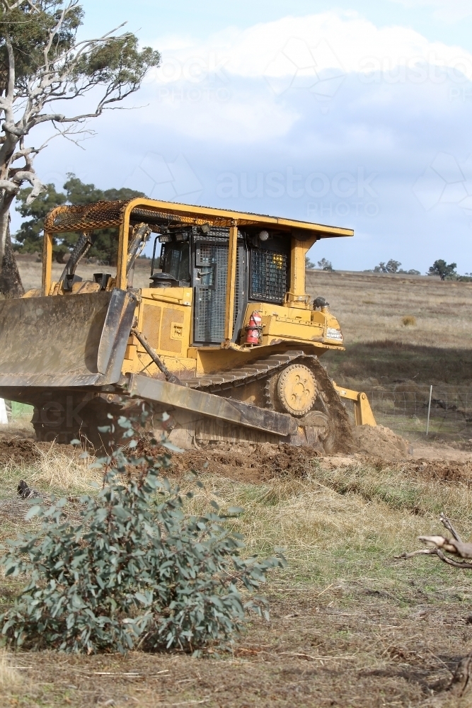 Ripping rabbit burrows - Australian Stock Image