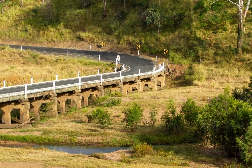 Road and bridge over Burnett River in rural Queensland. - Australian Stock Image