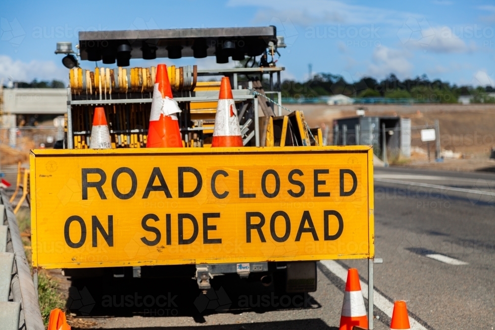 Road closed on side road sign near construction site - Australian Stock Image