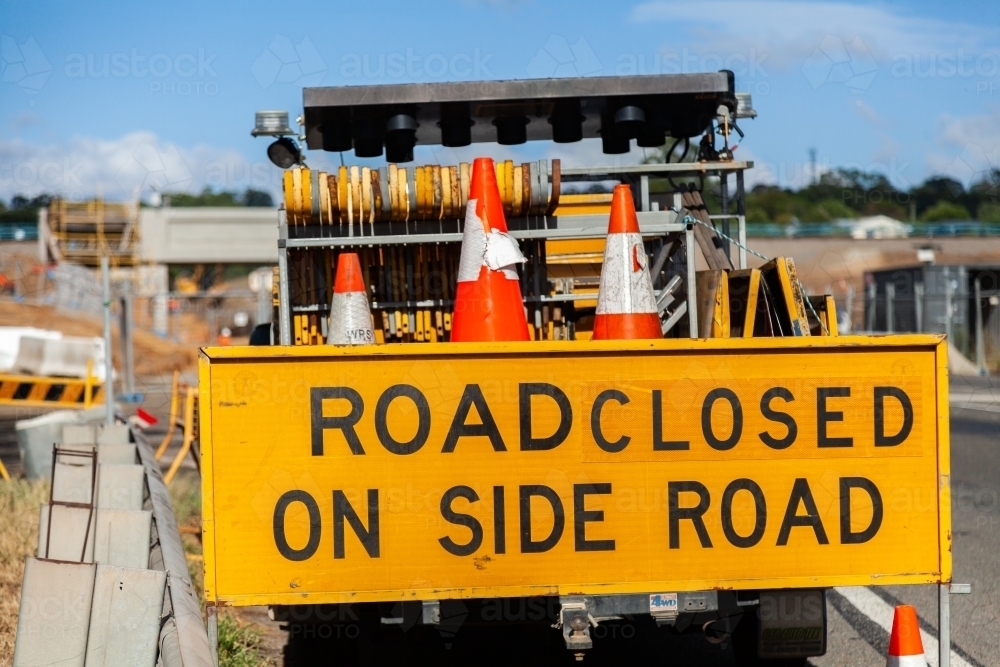 Road closed on side road sign near construction site - Australian Stock Image