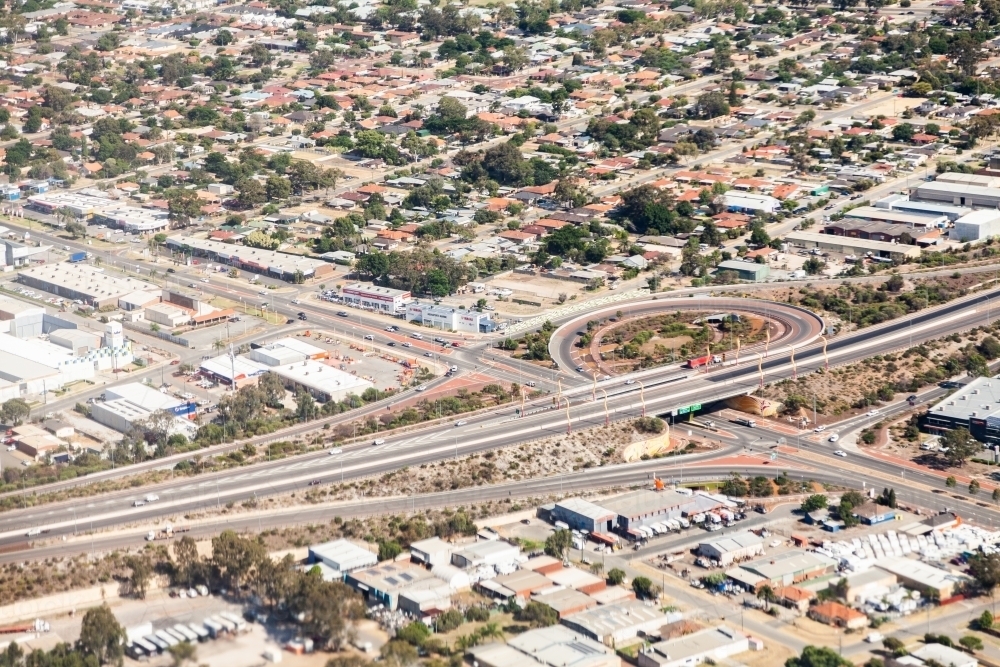 Road highway with off ramp and bridge beside industrial area - Australian Stock Image