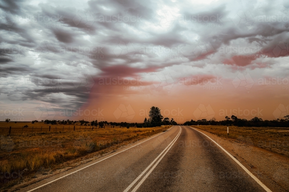 Road in the outback with overcast sky - Australian Stock Image