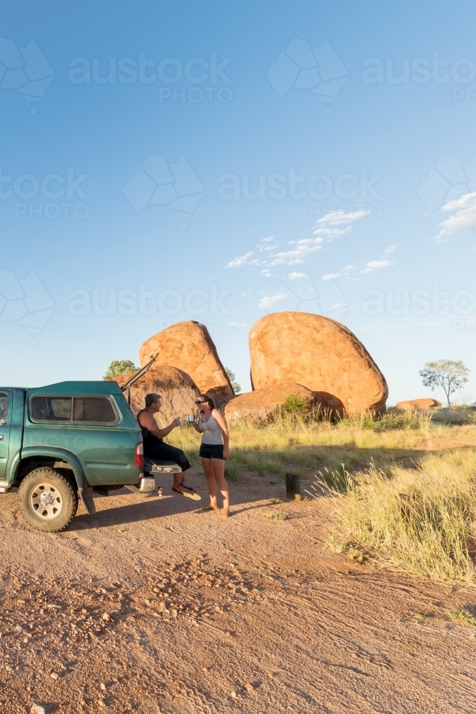 Roadtrip drink break, Devil's Marbles NT - Australian Stock Image