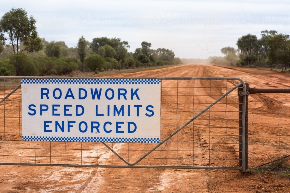 Roadworks sign on outback unsealed road - Australian Stock Image