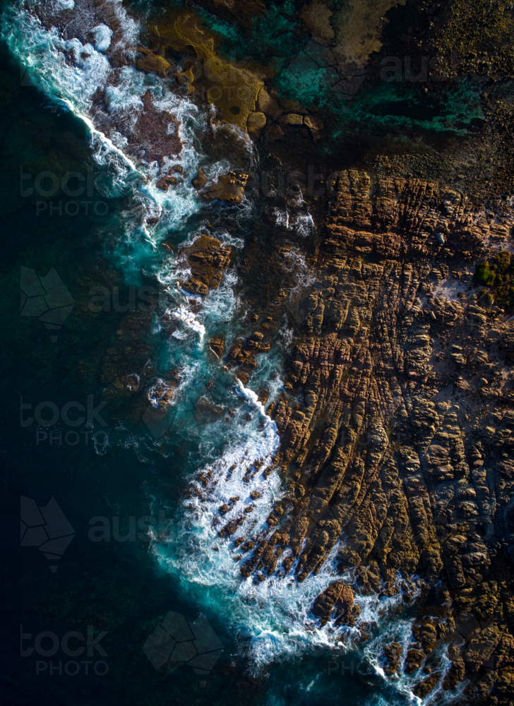 Rock textures exposed by morning light - Australian Stock Image