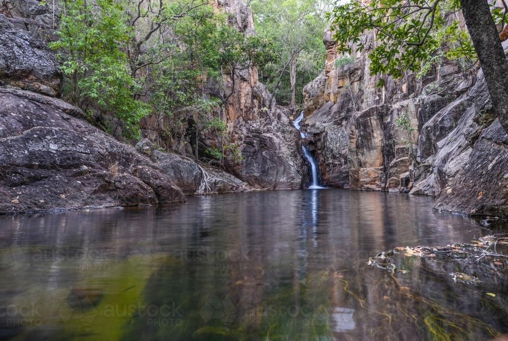 Rock water hole with small waterfall - Australian Stock Image