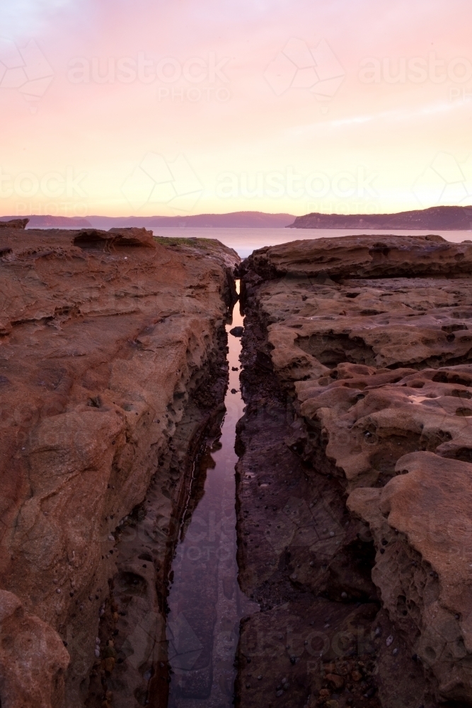 Rocks and water at sunset - Australian Stock Image