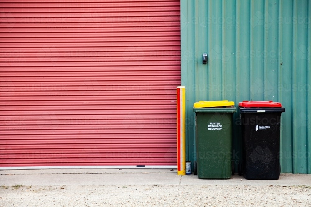 Rubbish and recycling bin outside shed - Australian Stock Image