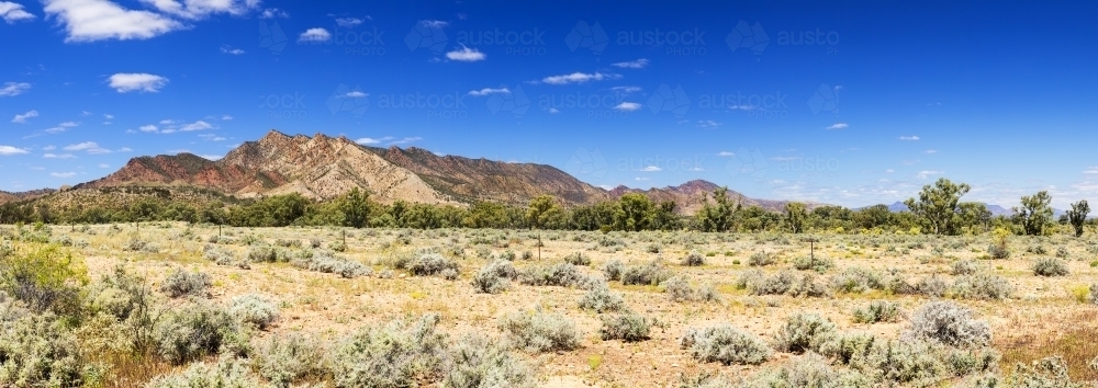 Rugged mountains rising from plains - Australian Stock Image