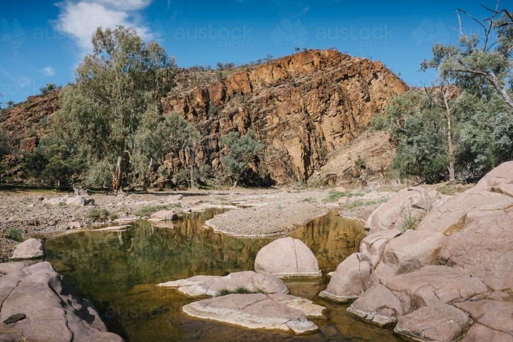 Rugged rocky outback landscape with rock pools - Australian Stock Image