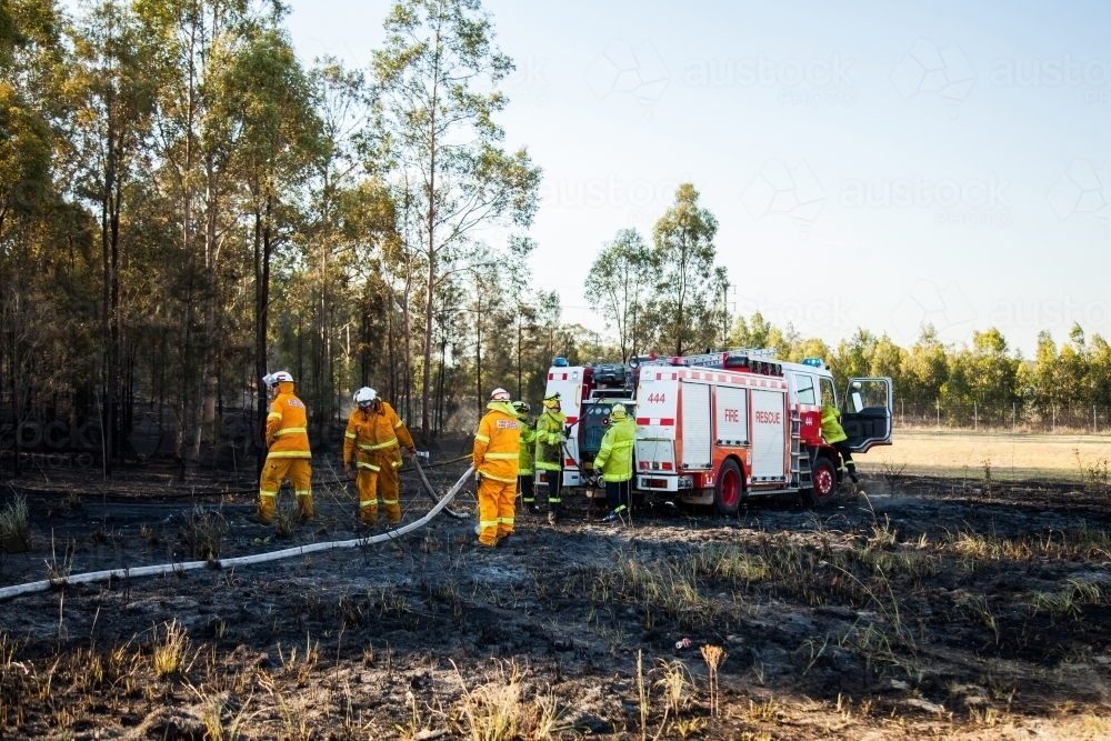 Rural fire service volunteers with firefighters and a fire truck - Australian Stock Image