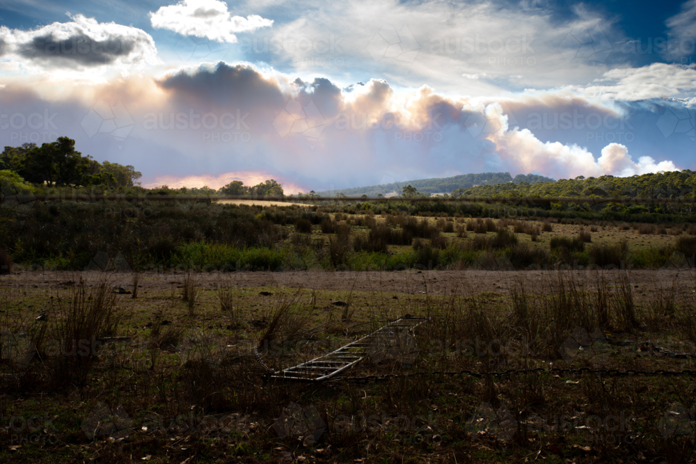 Rural landscape  with bushfire smoke on horizon - Australian Stock Image