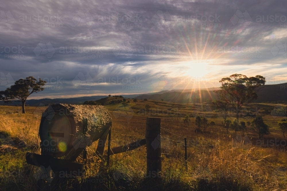 Rural mailbox on ridgeline in regional New South Wales with sun setting in background - Australian Stock Image
