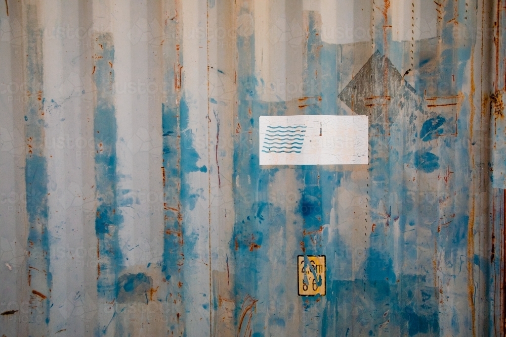 Rust and paint on corrugated metal of an old shipping container - Australian Stock Image