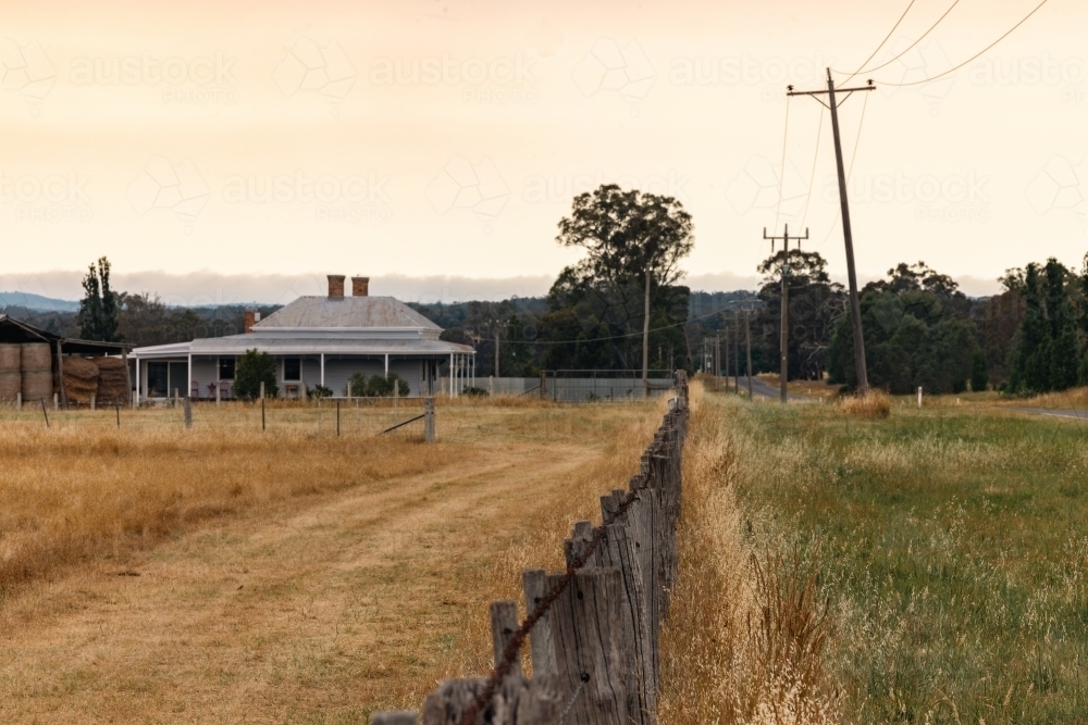 Rustic barbed wire fence on farm in country Victoria - Australian Stock Image