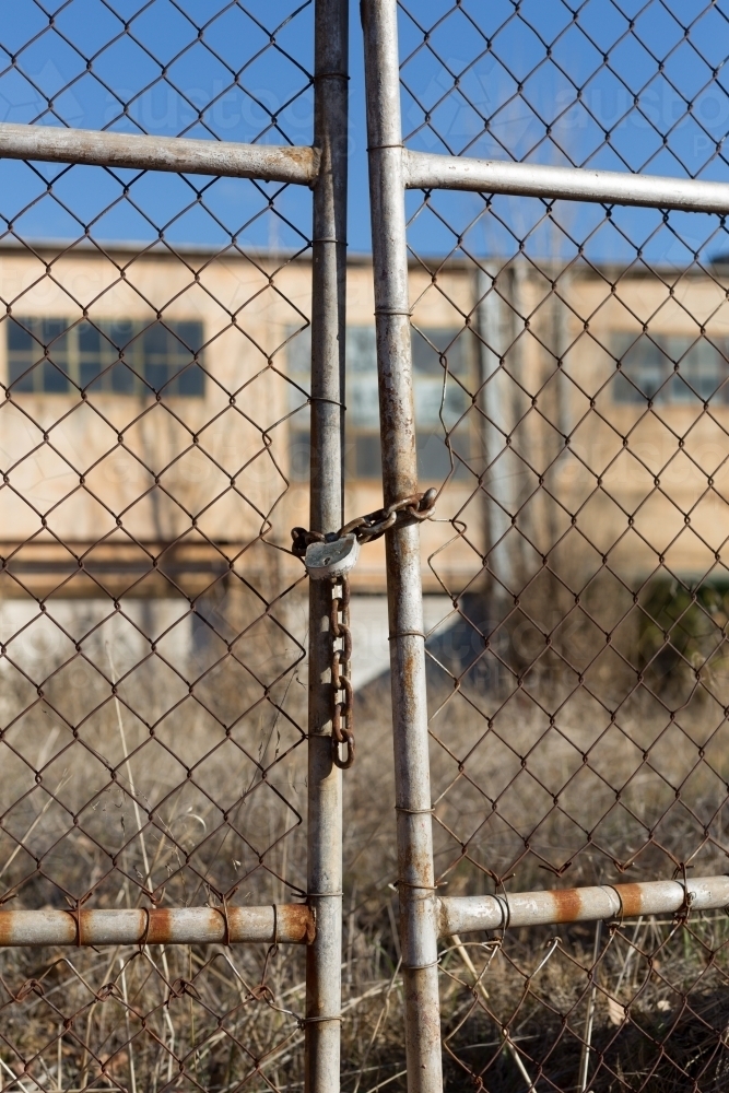 Rusty gate with chain and padlock - Australian Stock Image