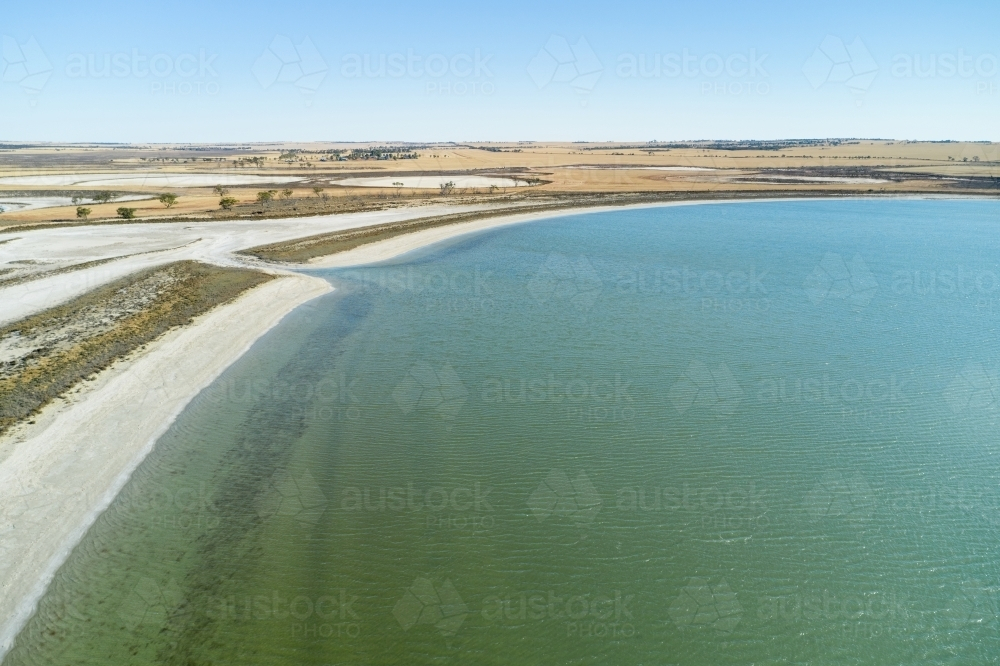 Salt lake in Western Australia, with the water in the lake contrasting with the dry landscape - Australian Stock Image