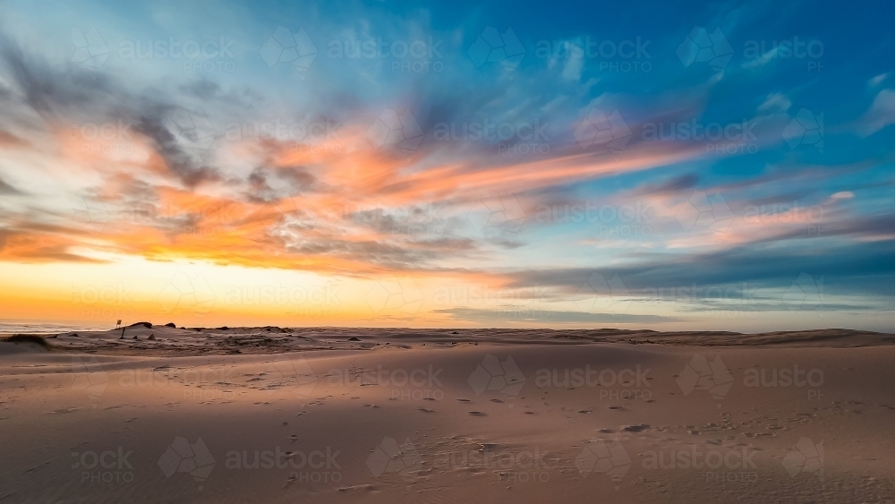 Sand dunes at Birubi Beach at sunset - Australian Stock Image