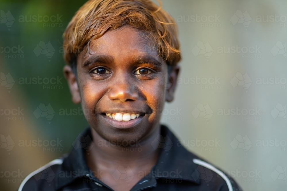 school-aged boy head and shoulders with blurry background - Australian Stock Image