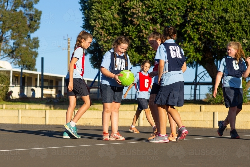 School children playing netball - Australian Stock Image