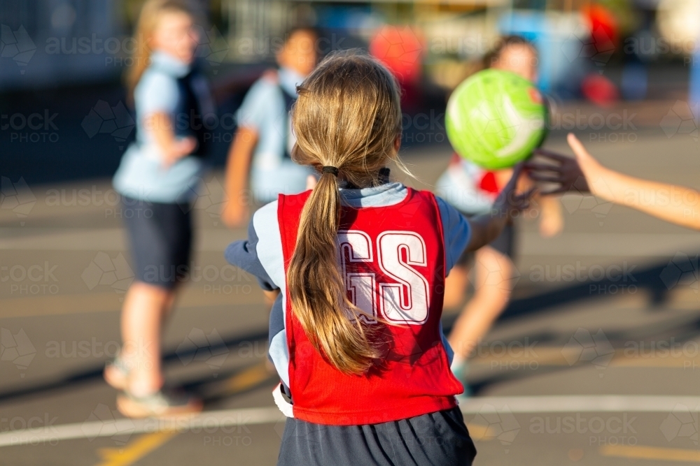 School girls playing a game of netball - Australian Stock Image