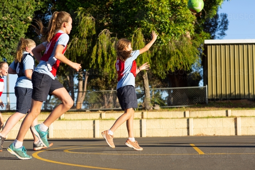 Schoolgirls playing netball - Australian Stock Image