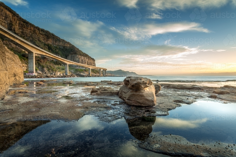 Sea Cliff Bridge from the rockshelf. - Australian Stock Image