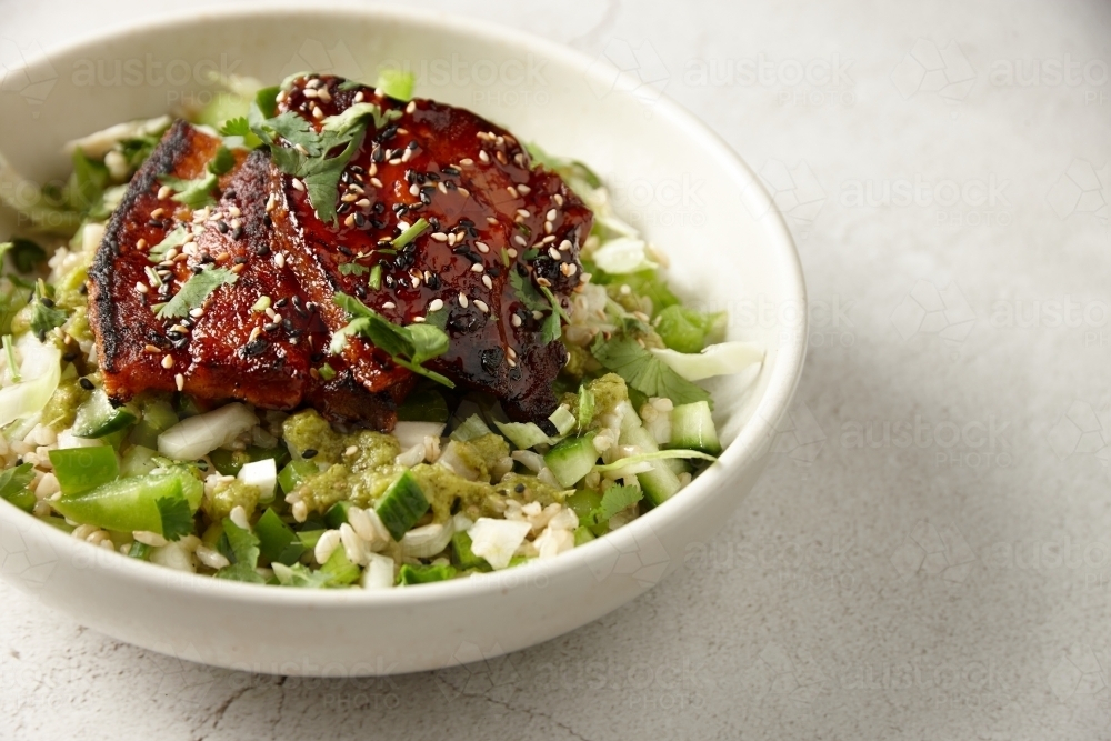 Seared eggplant with brown rice salad - Australian Stock Image