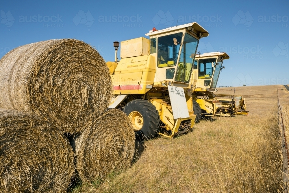 Secondhand farm machinery for sale on a rural property - Australian Stock Image