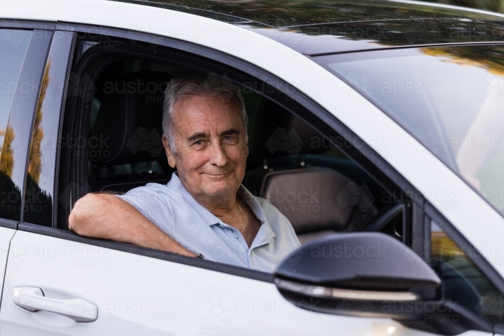 Image of senior driving car - Austockphoto