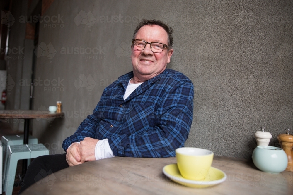 Senior Man Relaxing with Coffee - Australian Stock Image